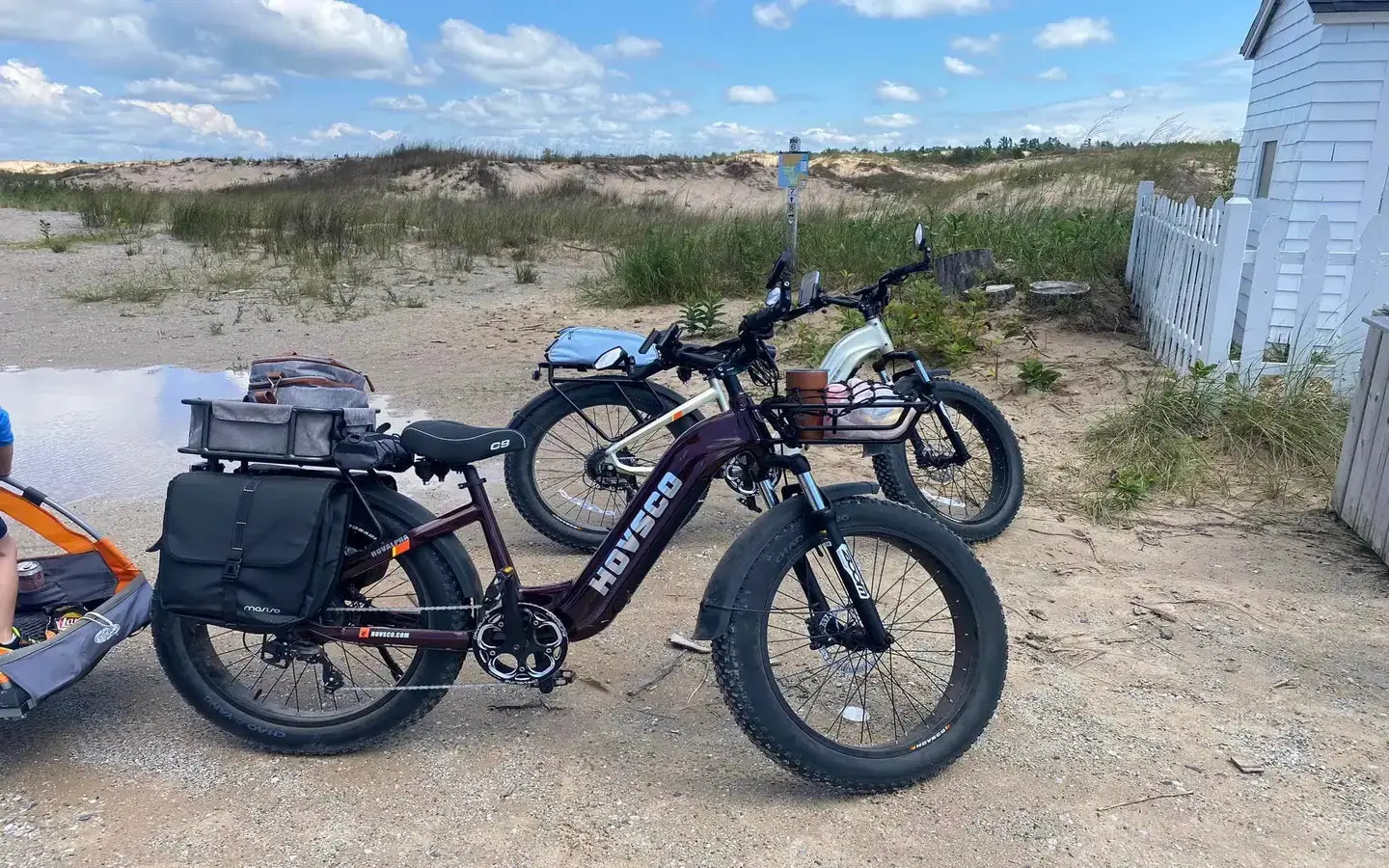 Which Electric Bikes Offer the Longest Range for Cross-Country Touring Adventures?