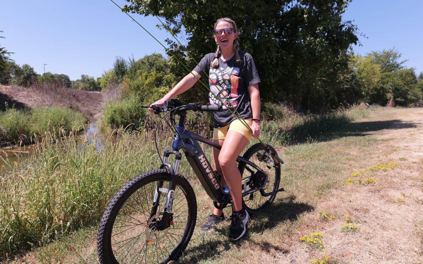 A-woman-cycling-on-a-path